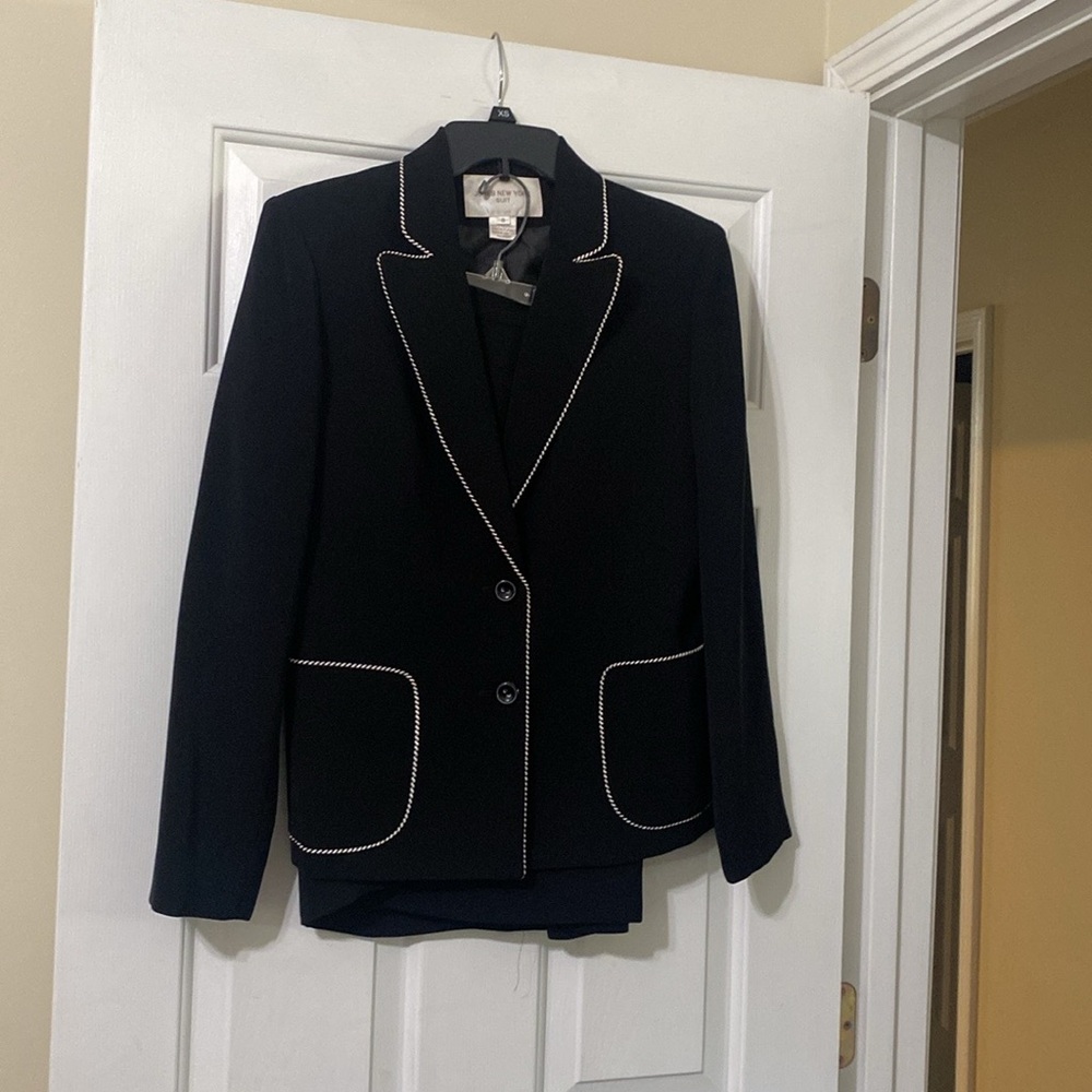 Black and white 2piece mid length skirt size 8 jacket have white stitching